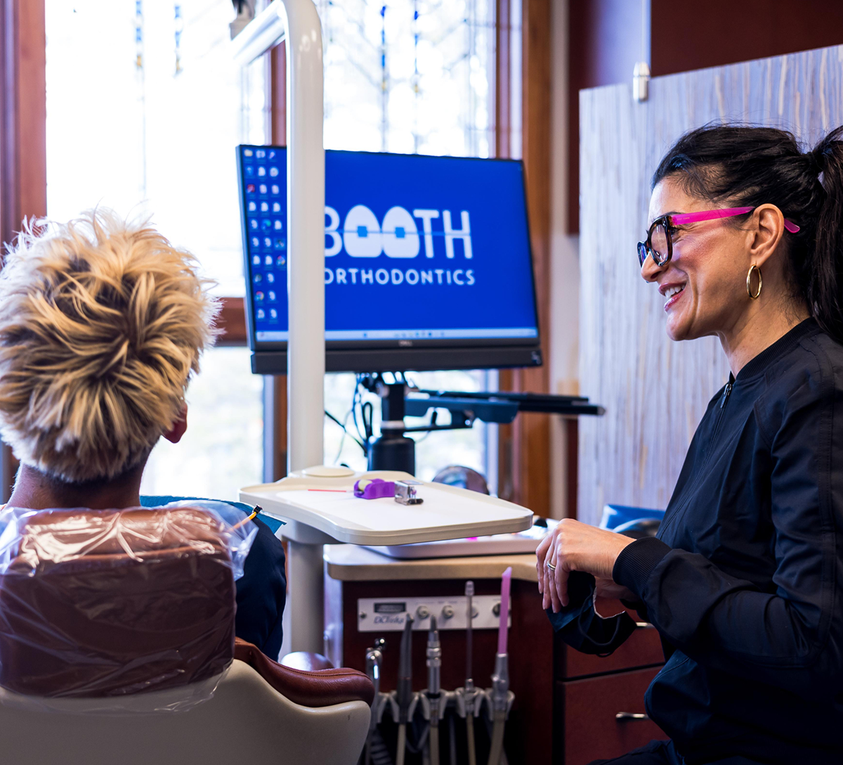 Dr. Booth and teen patient smiling