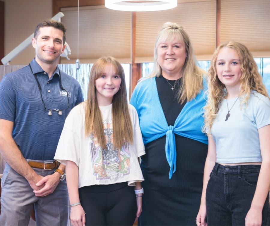 family smiling during orthodontic visit